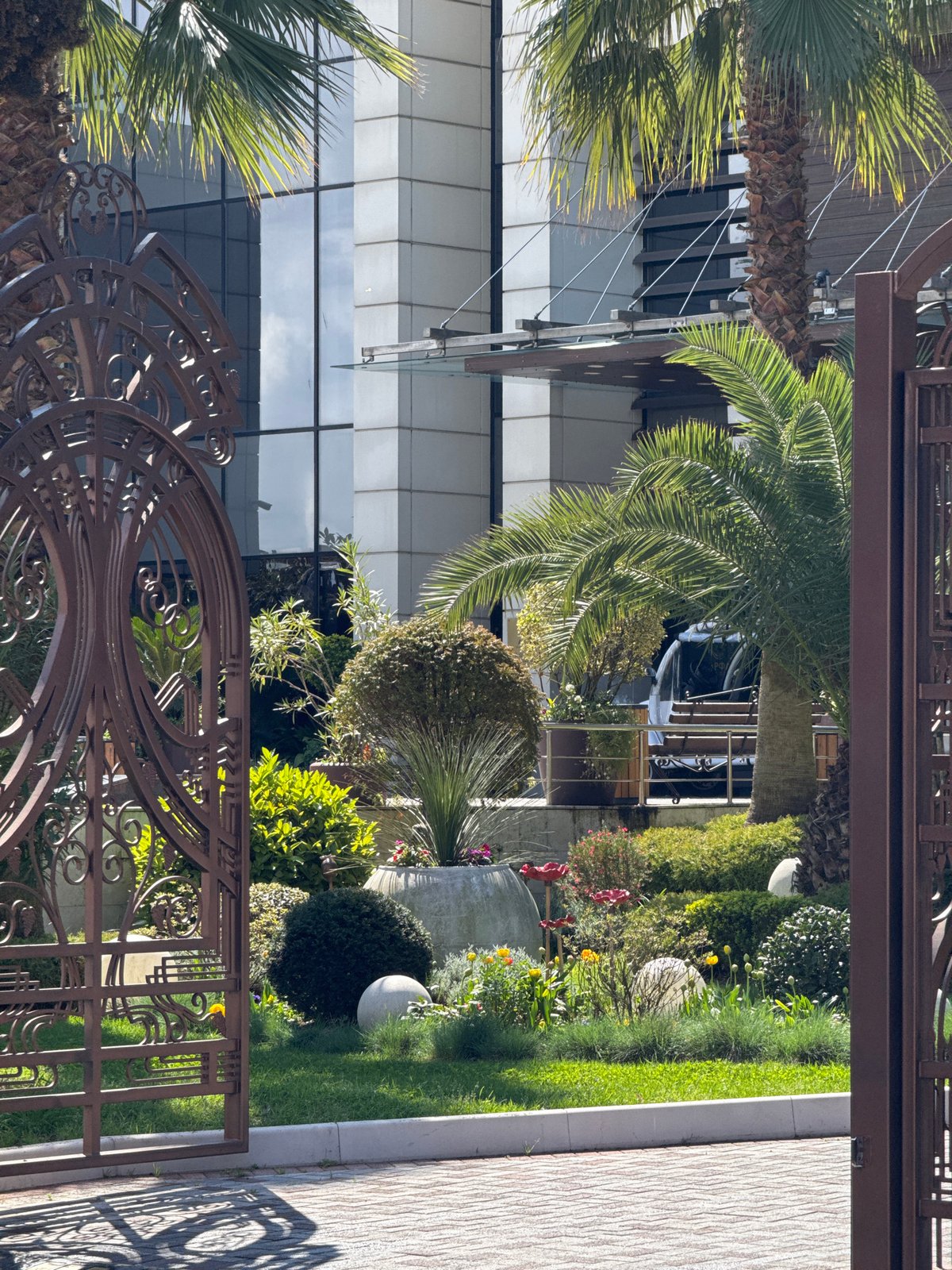 Garden and modern glass building documented in Sirius, Russia