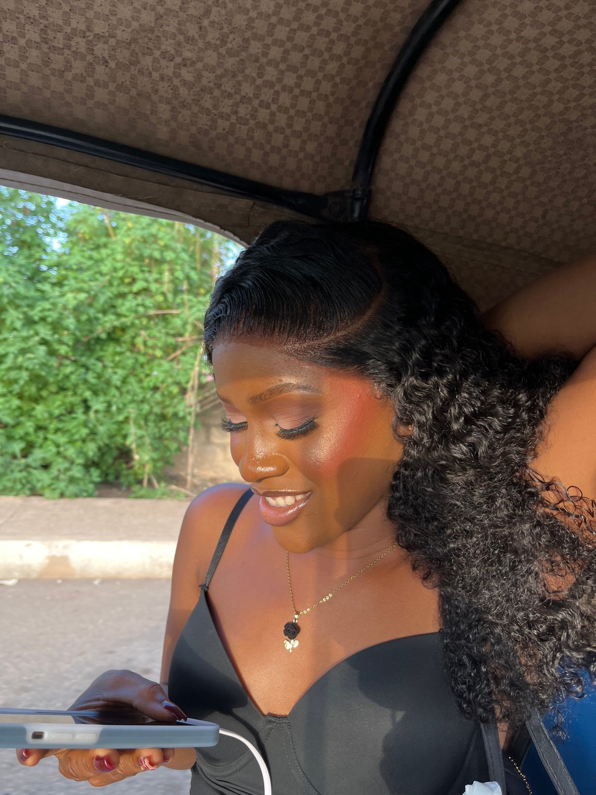Auto-rickshaw journey documented through Nigerian highlands and residential areas
