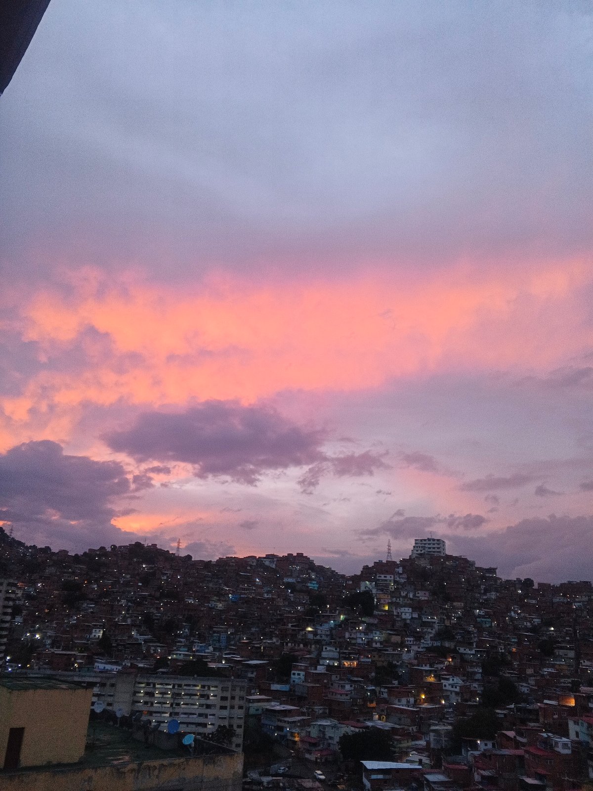 Evening twilight documented over Caracas hillside settlements