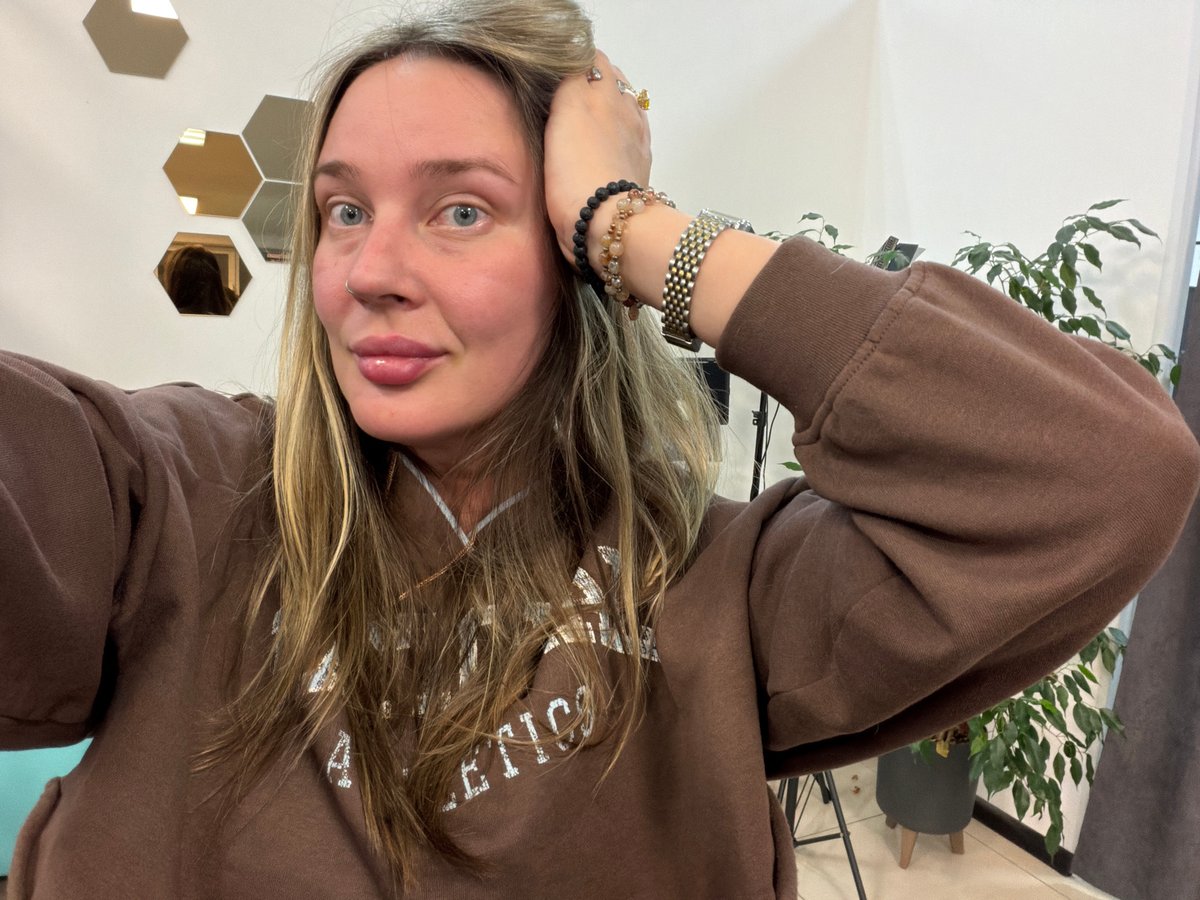 Woman takes mirror selfies at beauty salon in Chaikovsky