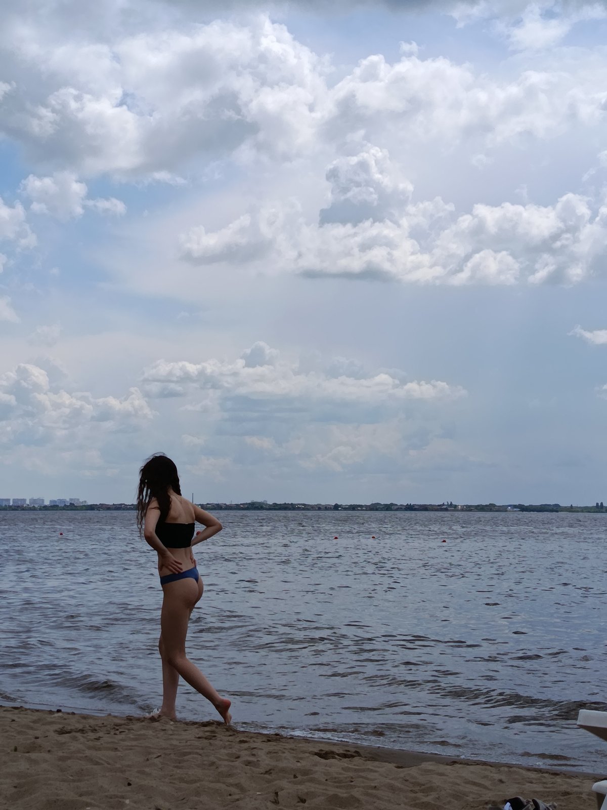 Beach hangout on a cloudy day, candid moments by the water