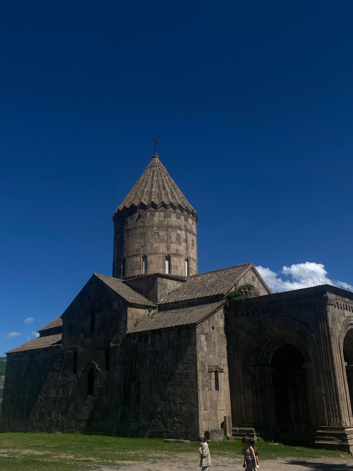 Visitor documents Tatev Monastery's architecture and religious artwork