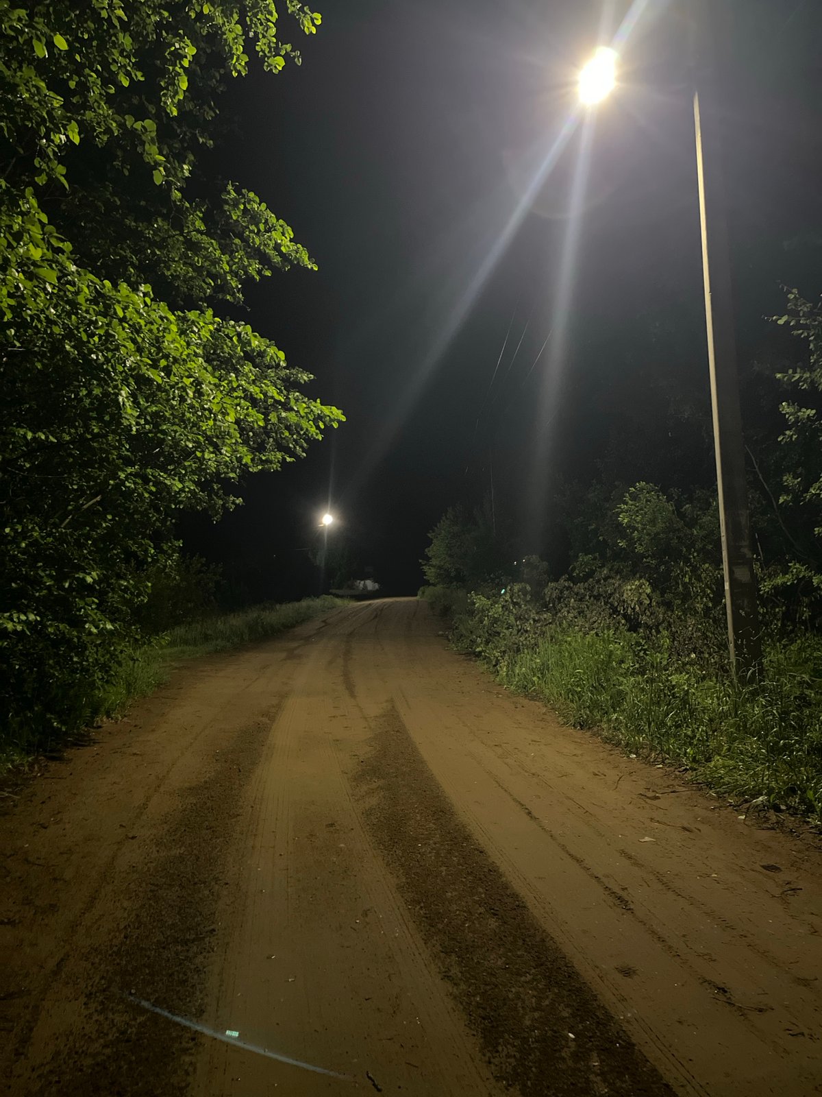 Night documentation of dirt road in Chaikovsky, Russia