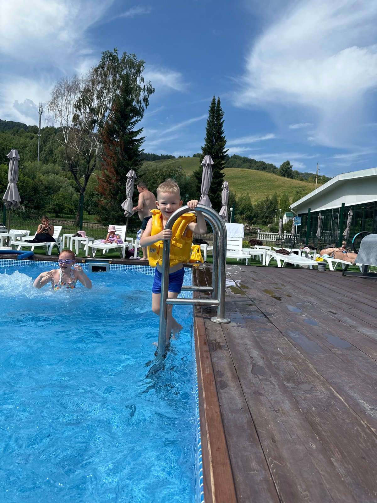 Sunny afternoon at an outdoor pool in Altai, Russia