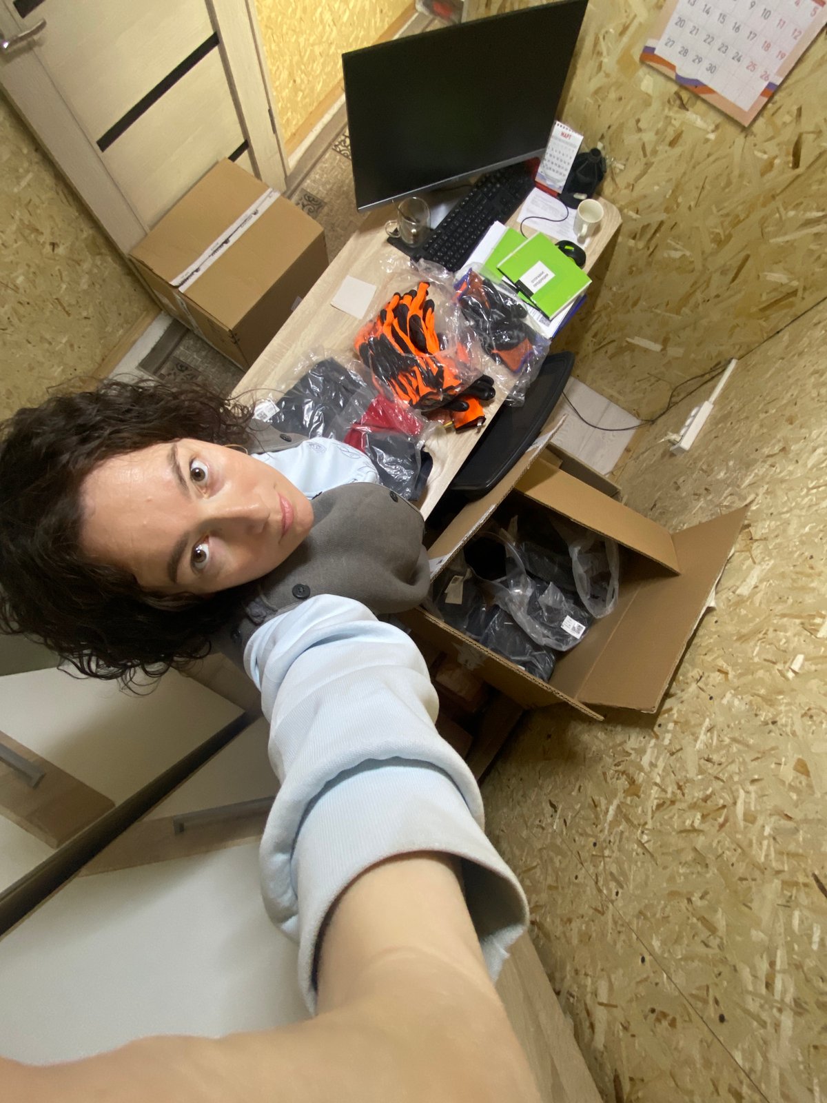 Woman photographed with Russian documents in Ol'khovskoye storage room