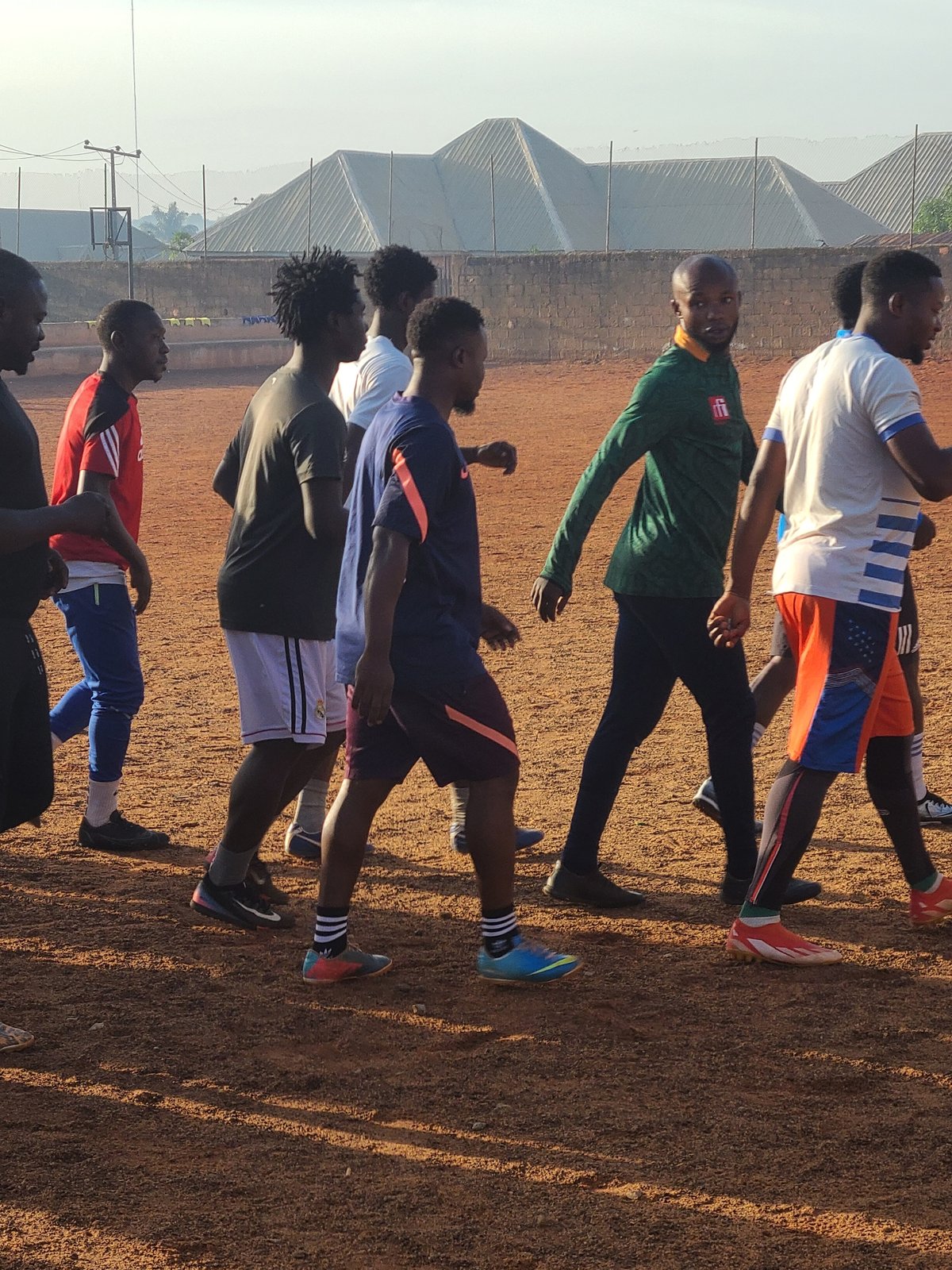 Young men conduct morning football training in Nigeria
