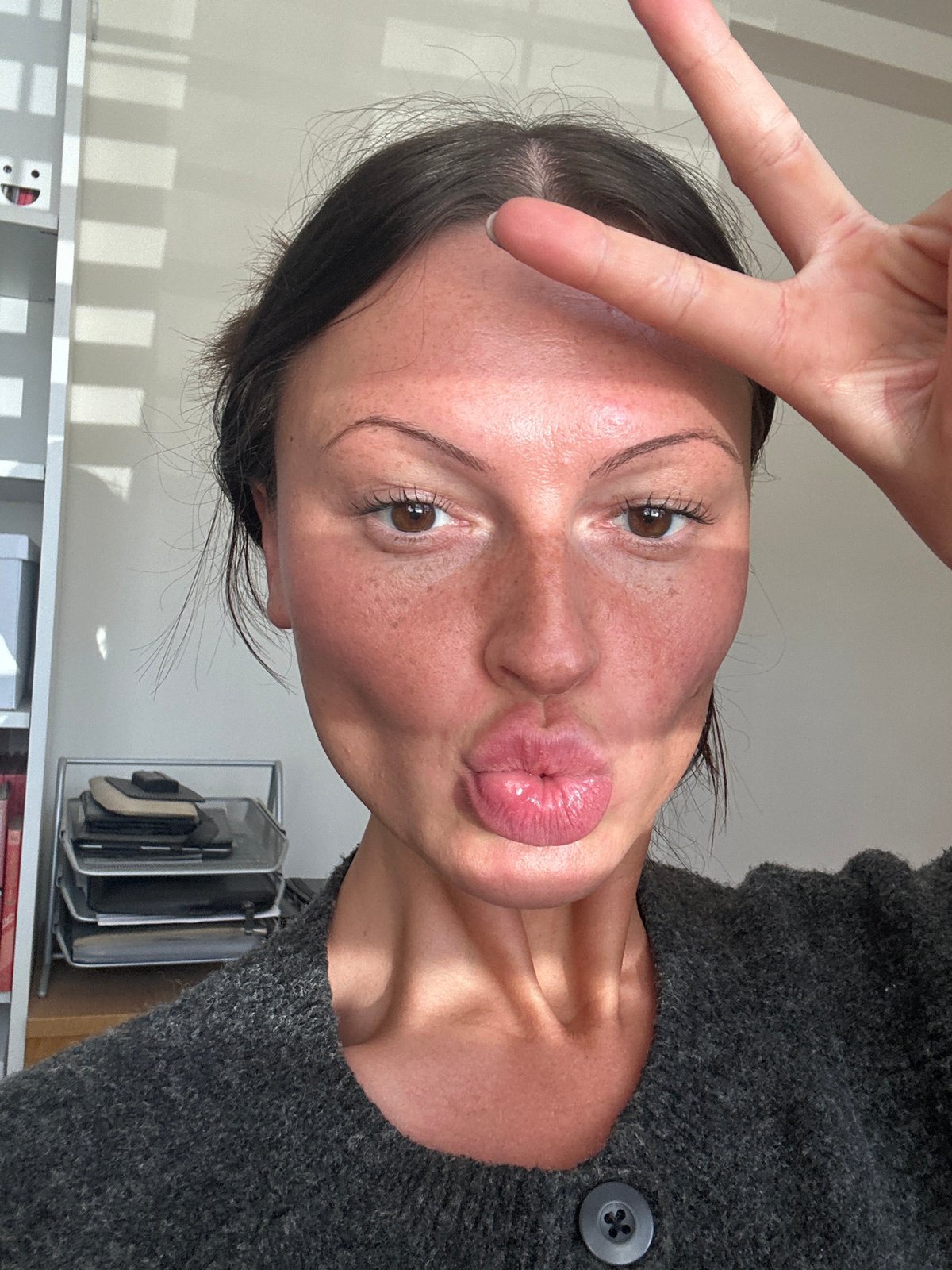 Woman takes peace sign selfie in Tunbridge Wells