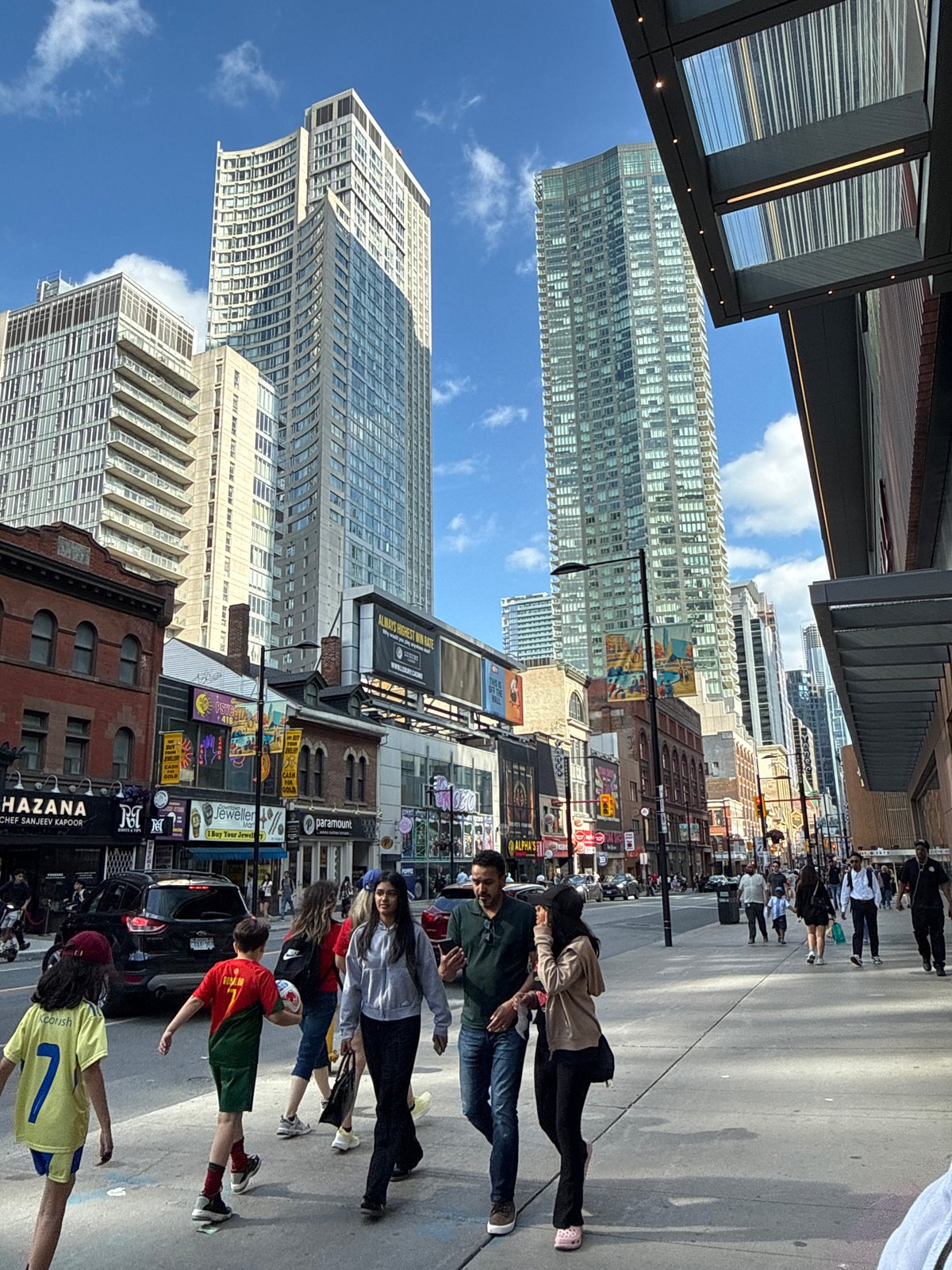 Evening street life and shopping captured across downtown Toronto
