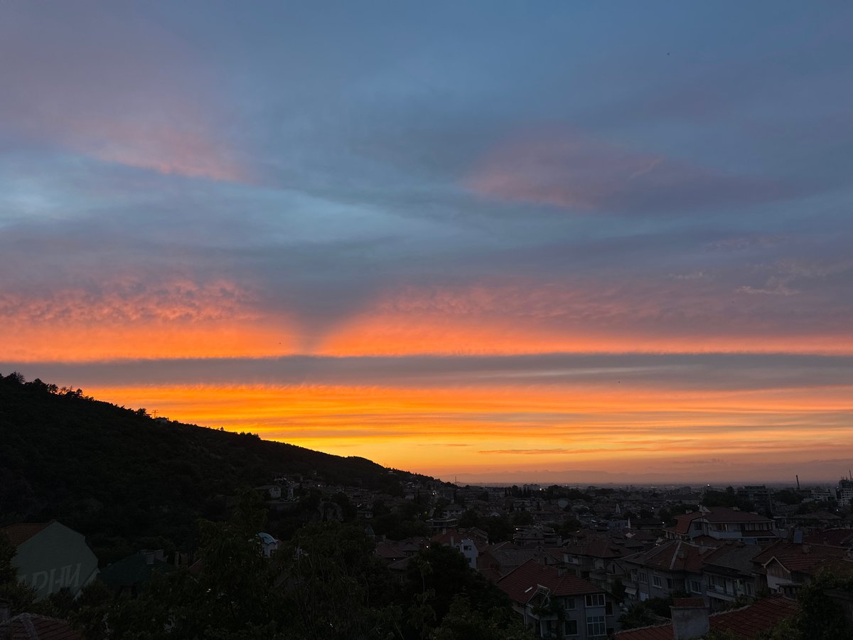 Asenovgrad sunset viewed from above, Pomeranian asleep inside