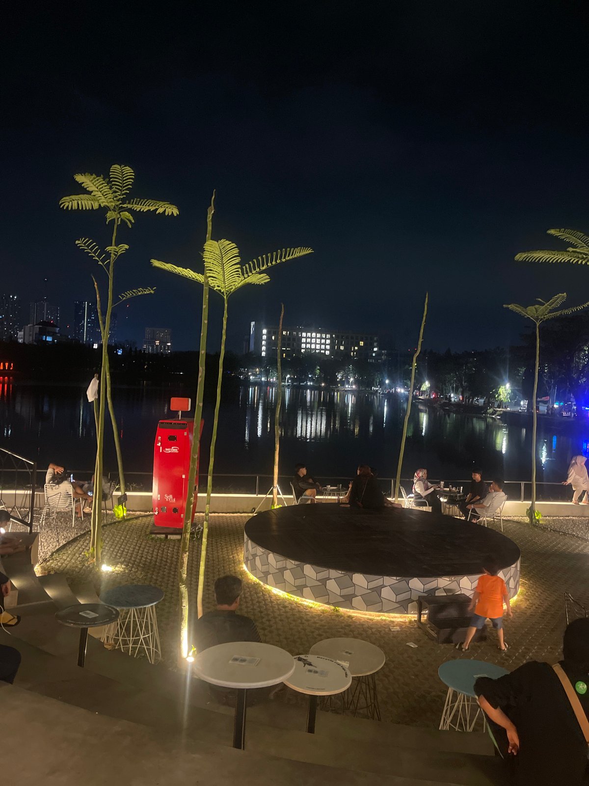 Evening at a waterfront cafe strip in Surabaya, Indonesia
