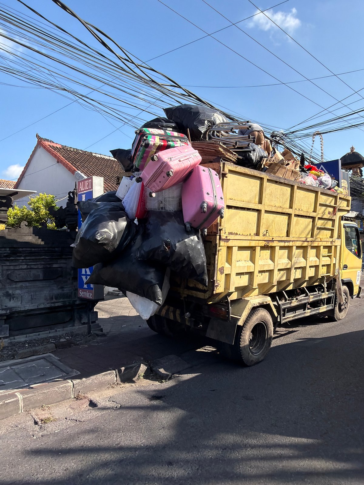 Loaded dump truck parked roadside in North Kuta