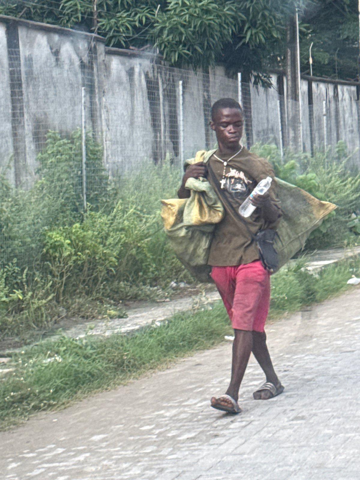 Afternoon scenes in Igboefon: a court seizure notice and balcony drinks