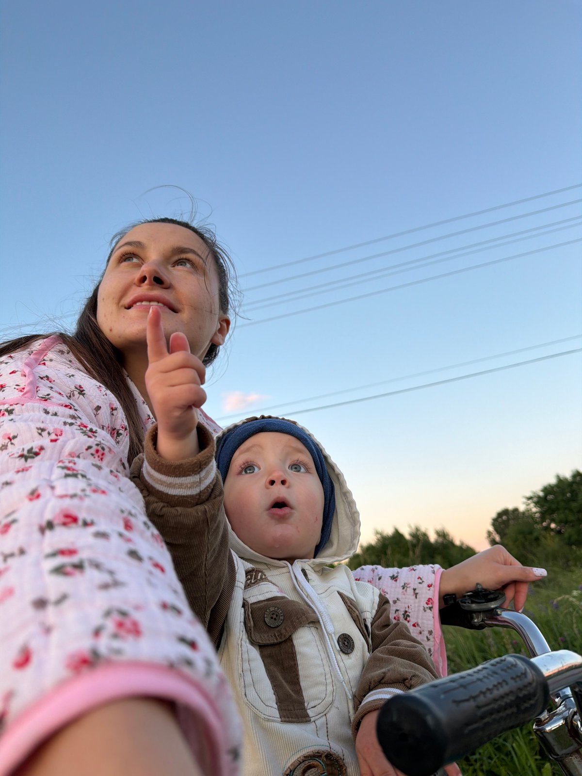 Dusk bike ride through a quiet Russian village with a child
