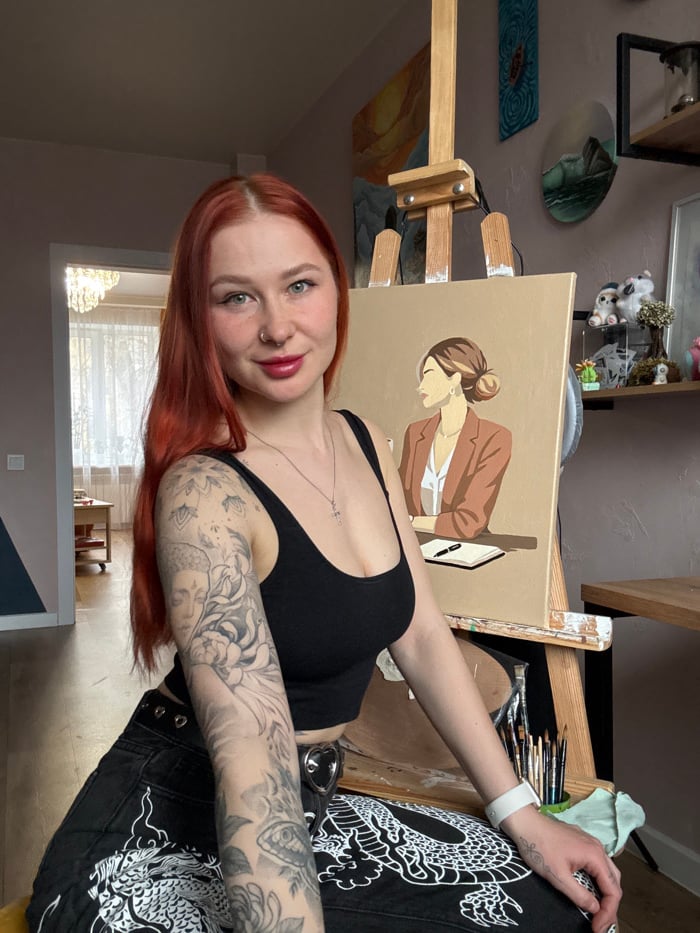 Red-haired artist documented in Rostov-on-Don studio space