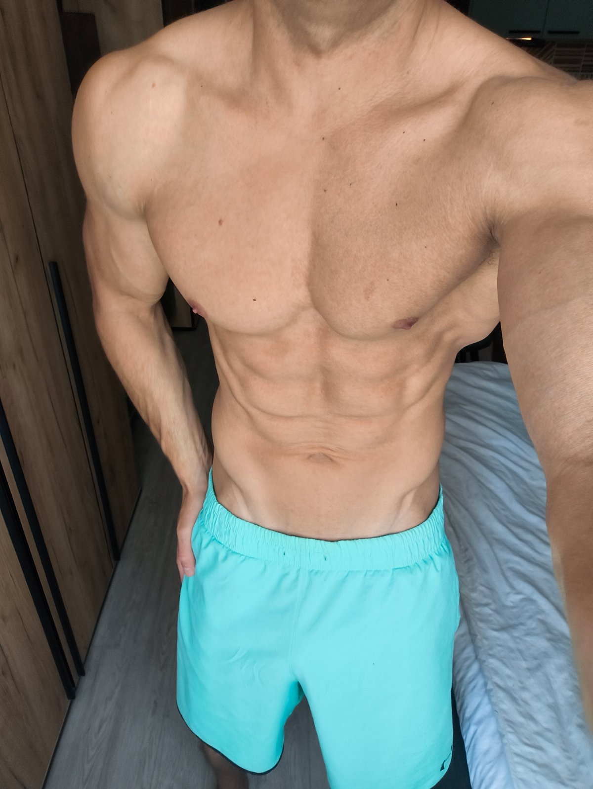 Shirtless man recorded posing in Moscow bedroom
