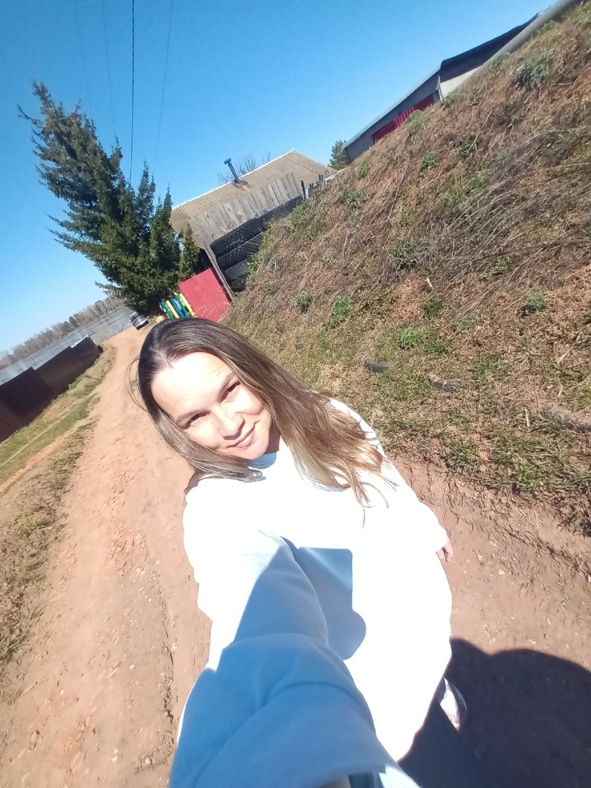 Woman photographed in multiple outdoor scenes in Ольховка, Russia
