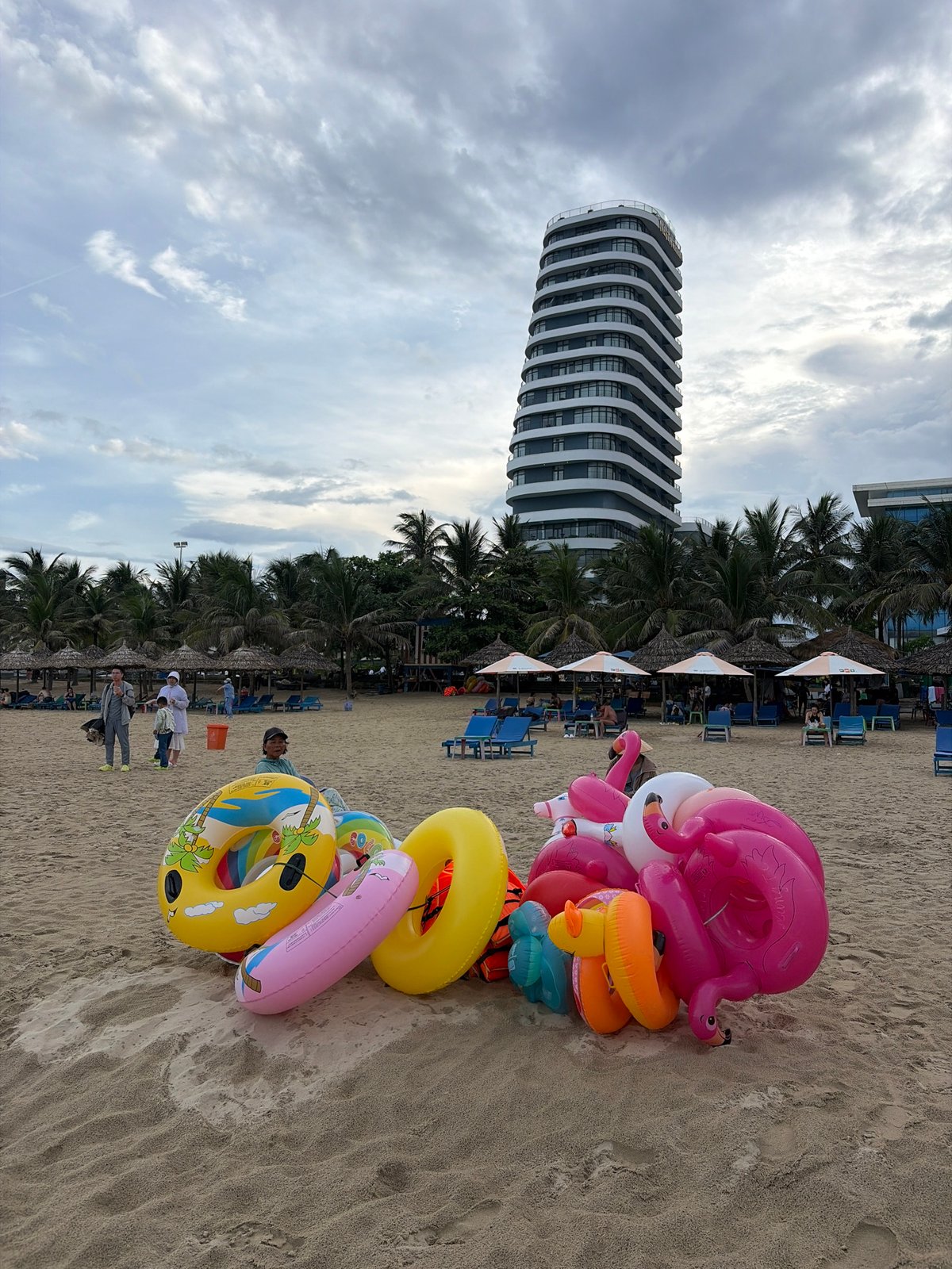 Da Nang beachfront: sand, umbrellas, and coastal streets on a summer morning