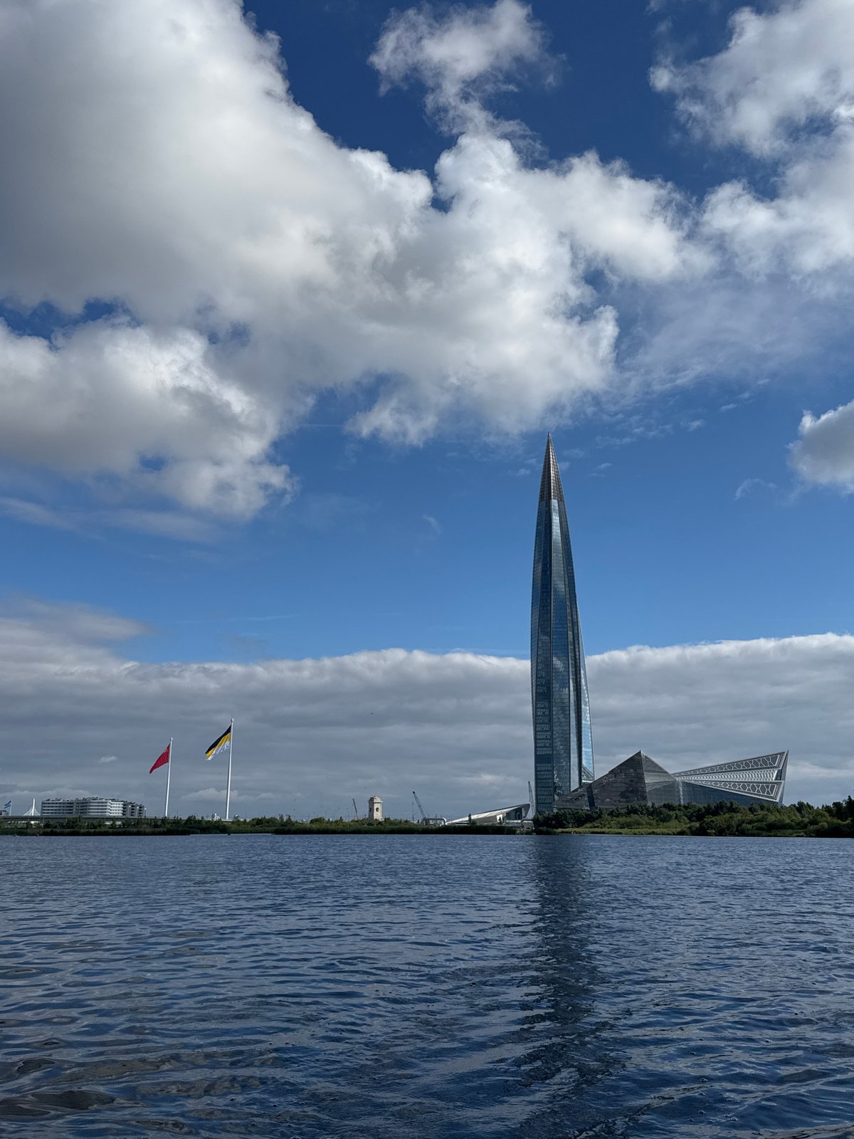 Kayaking past lily pads with Lakhta Center in the distance