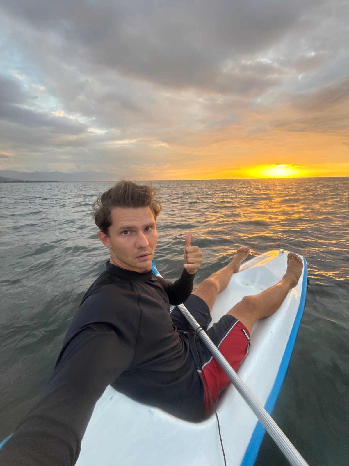 Paddleboarding and kayaking off Buleleng at sunset