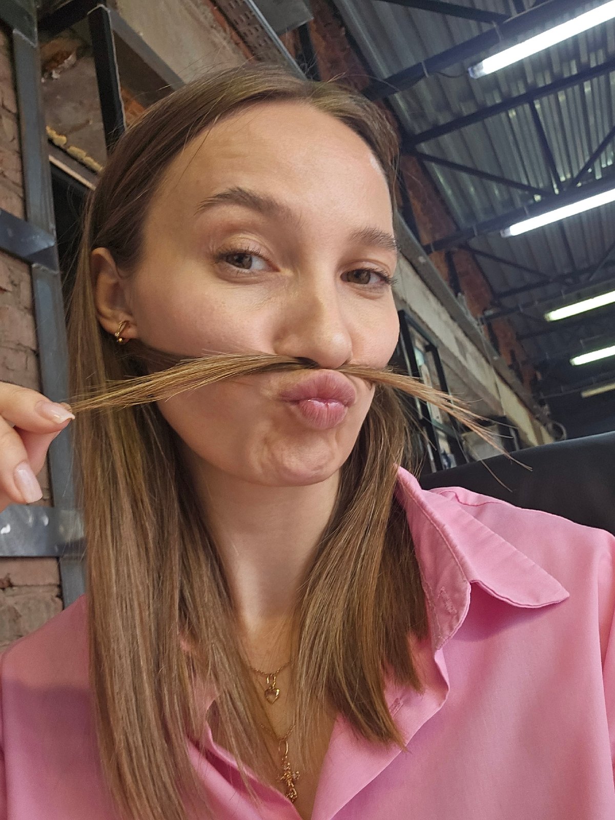 Woman documents morning workday in Chaikovsky office space