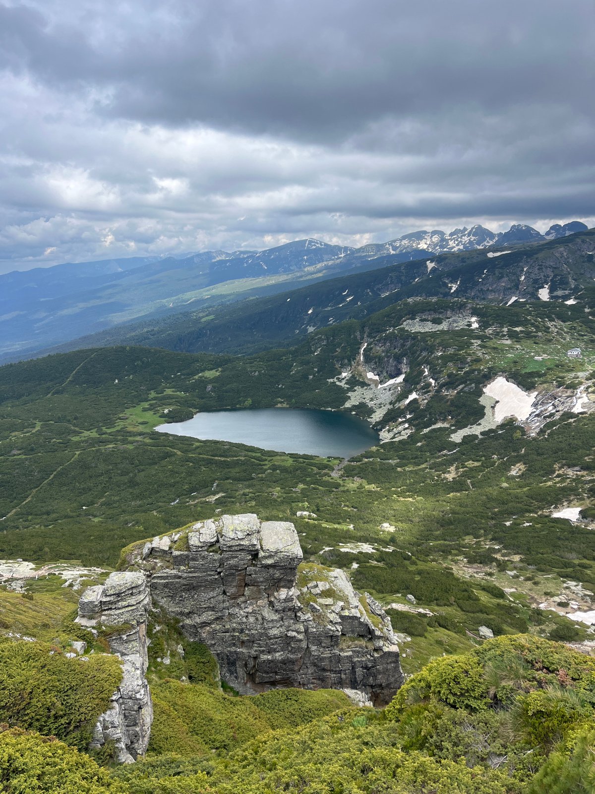 Morning in the Rila Mountains, rocks, lake, and open sky