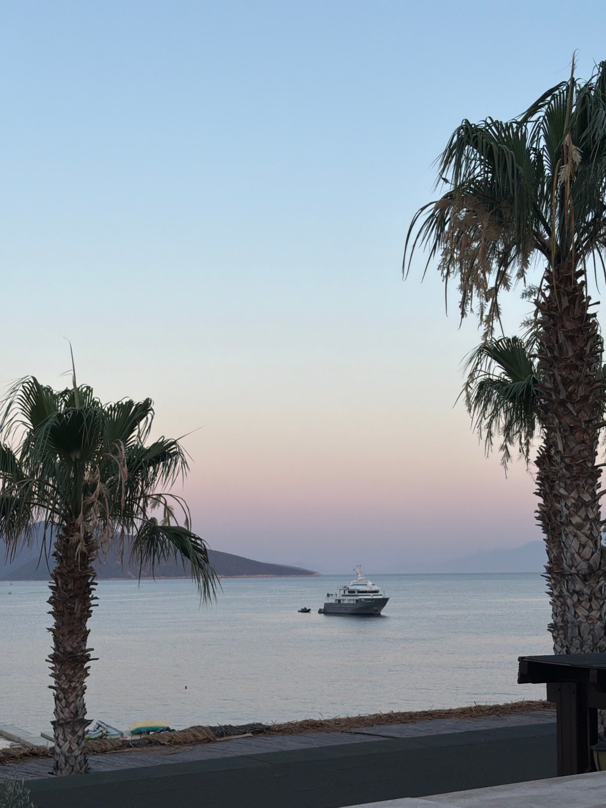 Yacht anchored off Bodrum coast at twilight