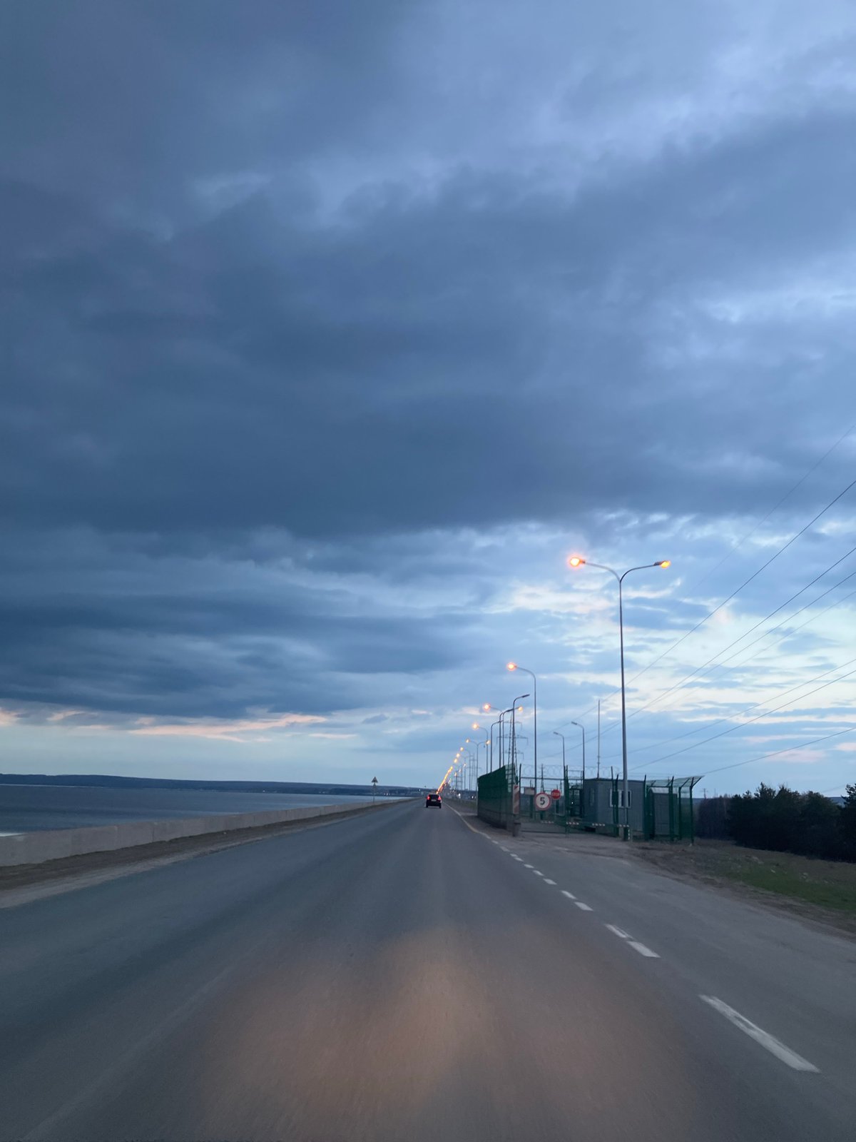 Highway photographed alongside water body in Noviy, Russia