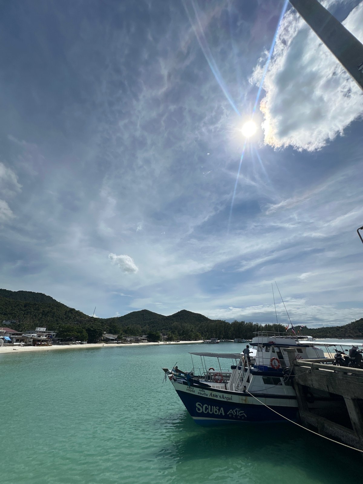 Lazy morning at Koh Phangan's harbor, pier, and beachside cafés