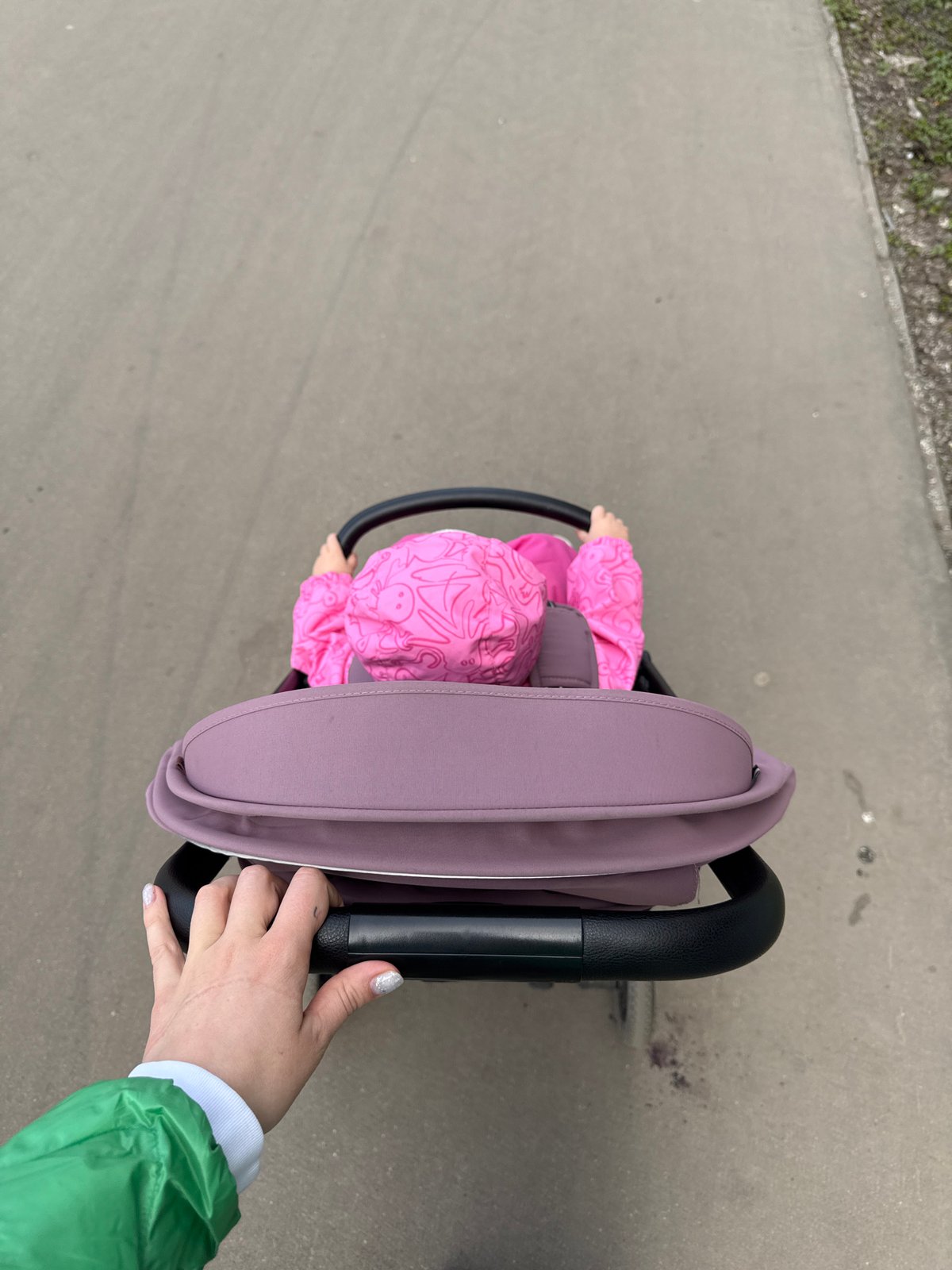 Family stroller walk documented during spring morning in Moscow