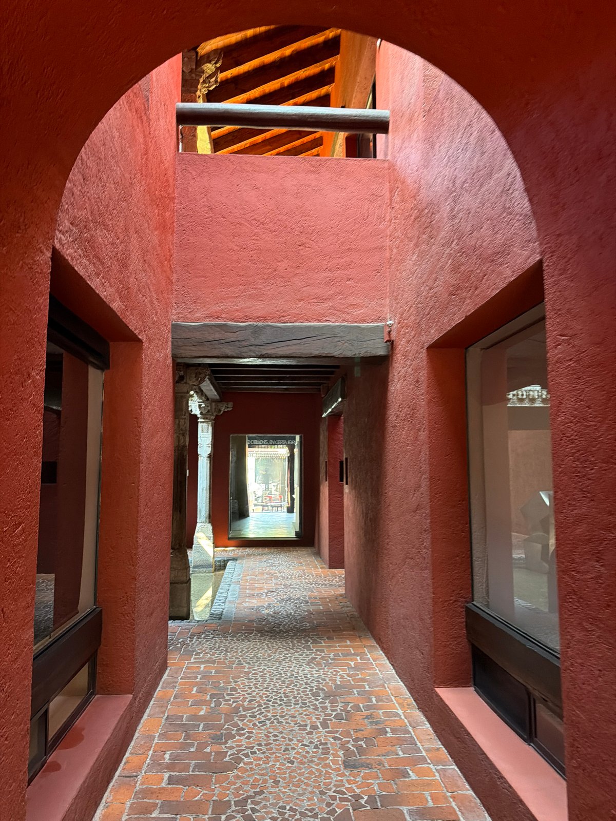 Visitor documents architectural details during afternoon stroll in Puebla