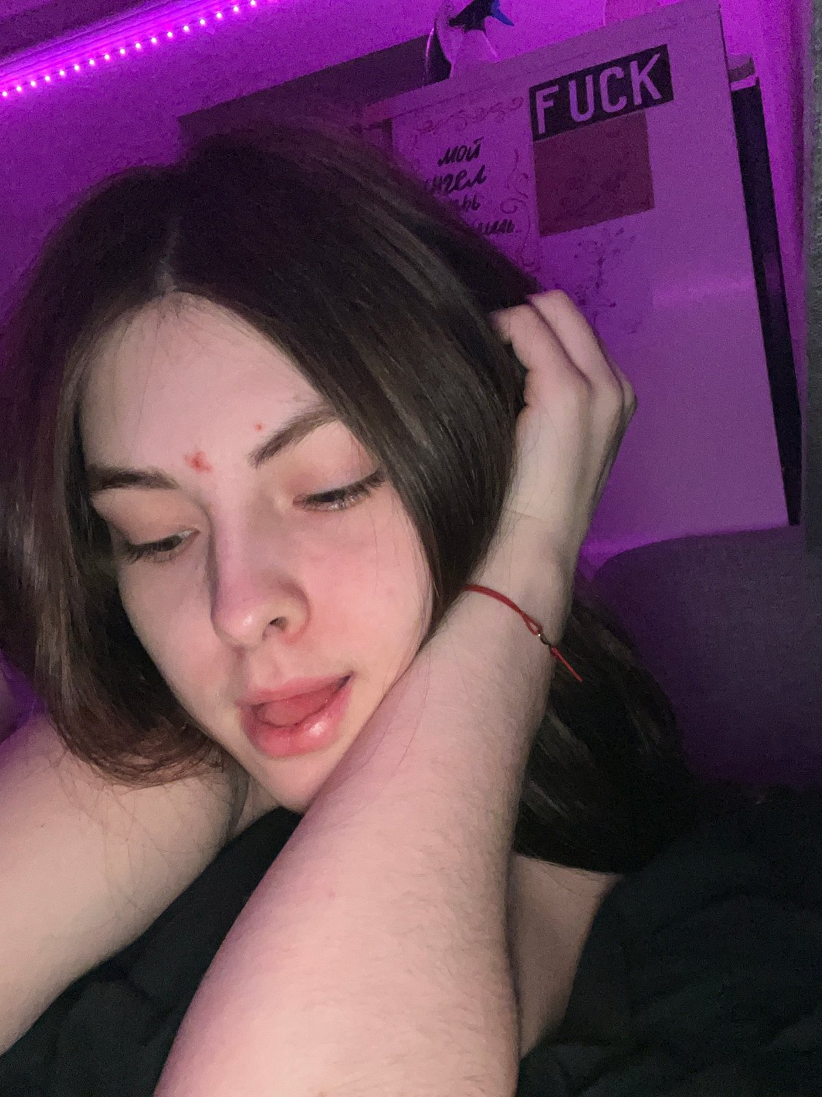 Private photo session captured in purple-lit Saint Petersburg apartment