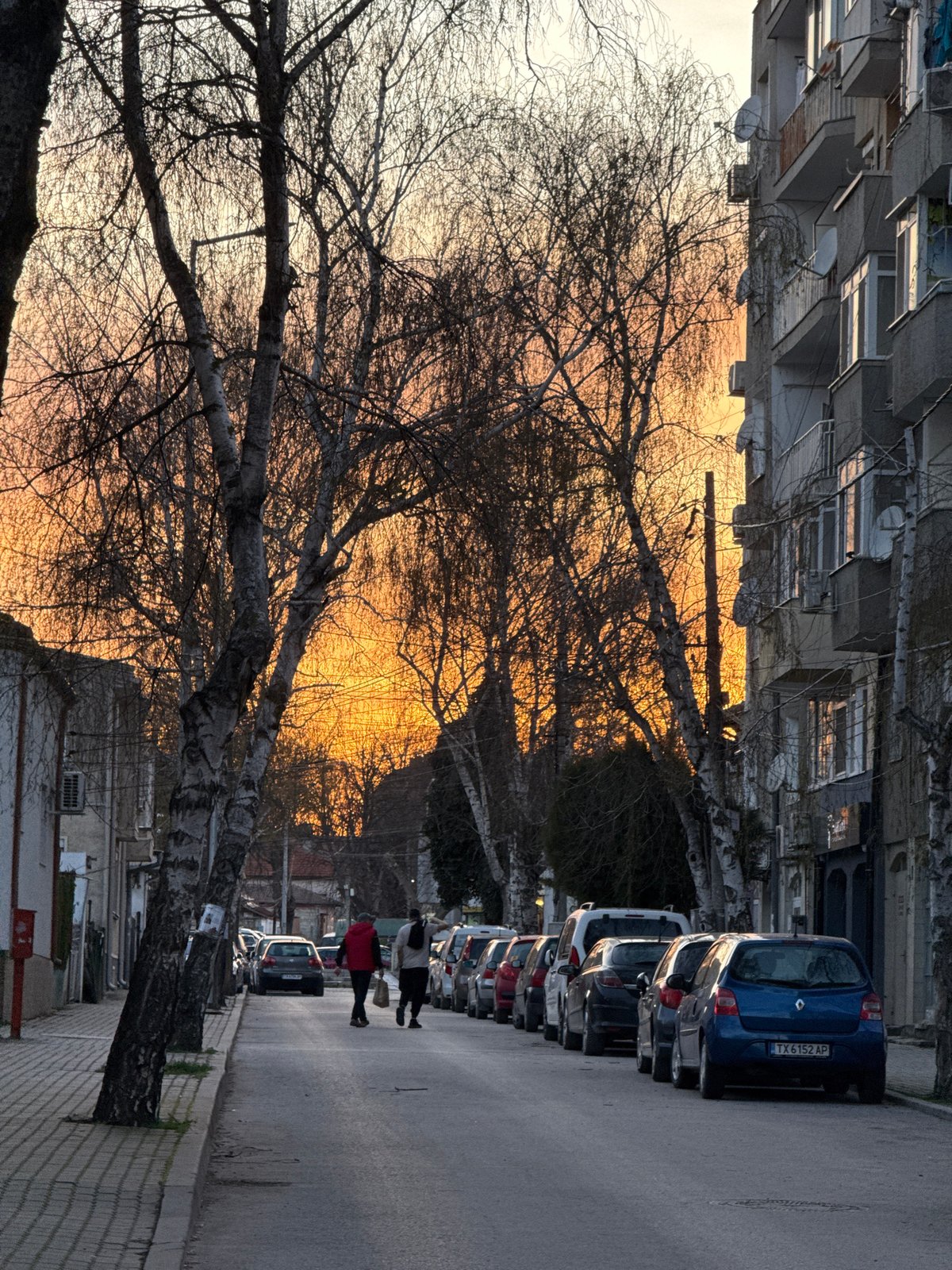 Two people spotted on sunset street in Dobrich, Bulgaria