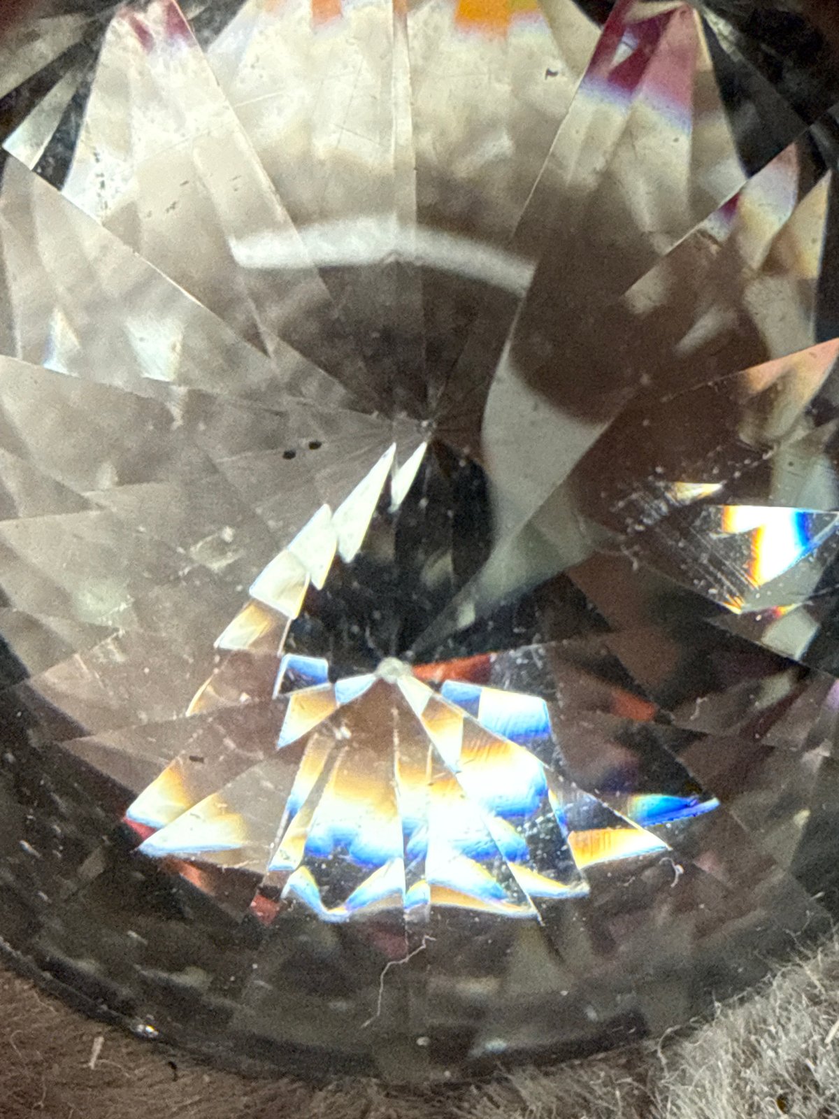 Cut crystal object photographed showing intricate light reflections