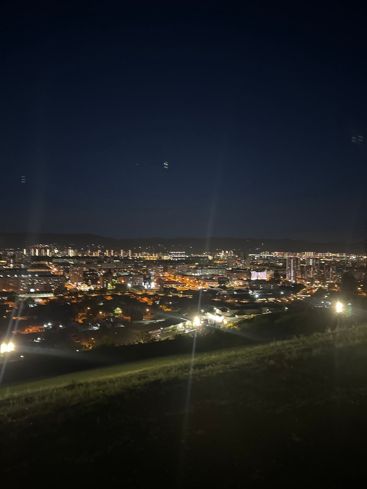 Paraskeva Pyatnitsa Chapel glowing over Krasnoyarsk at night