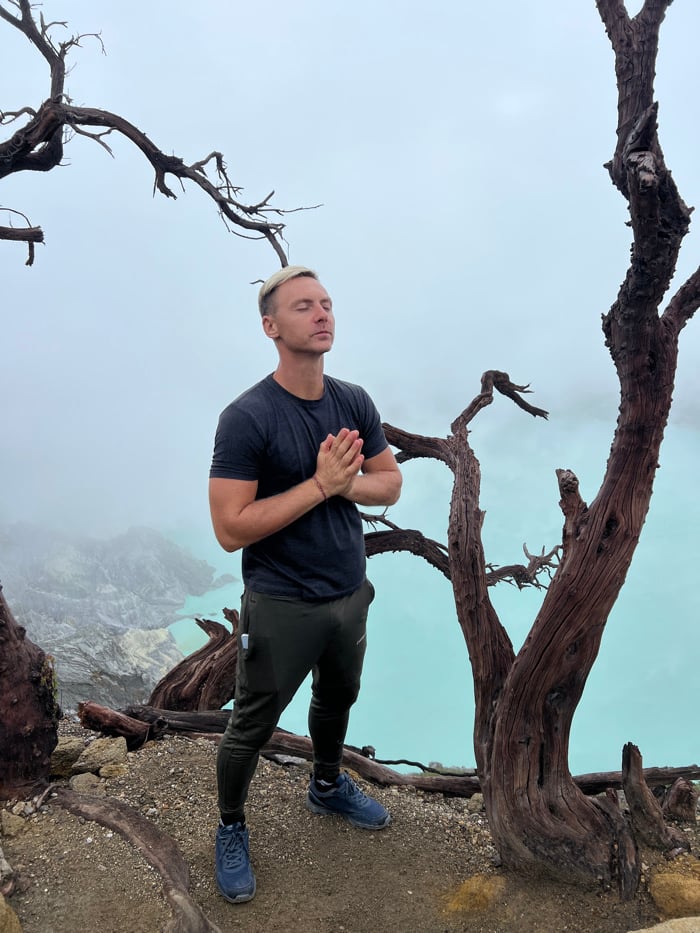 Hikers navigate foggy mountain terrain in Indonesia