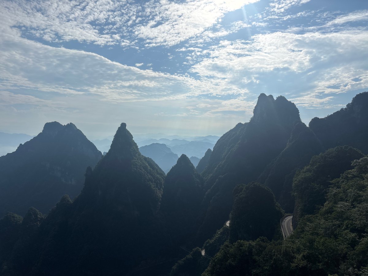 Zhangjiajie's jagged peaks under a cloud-streaked sky