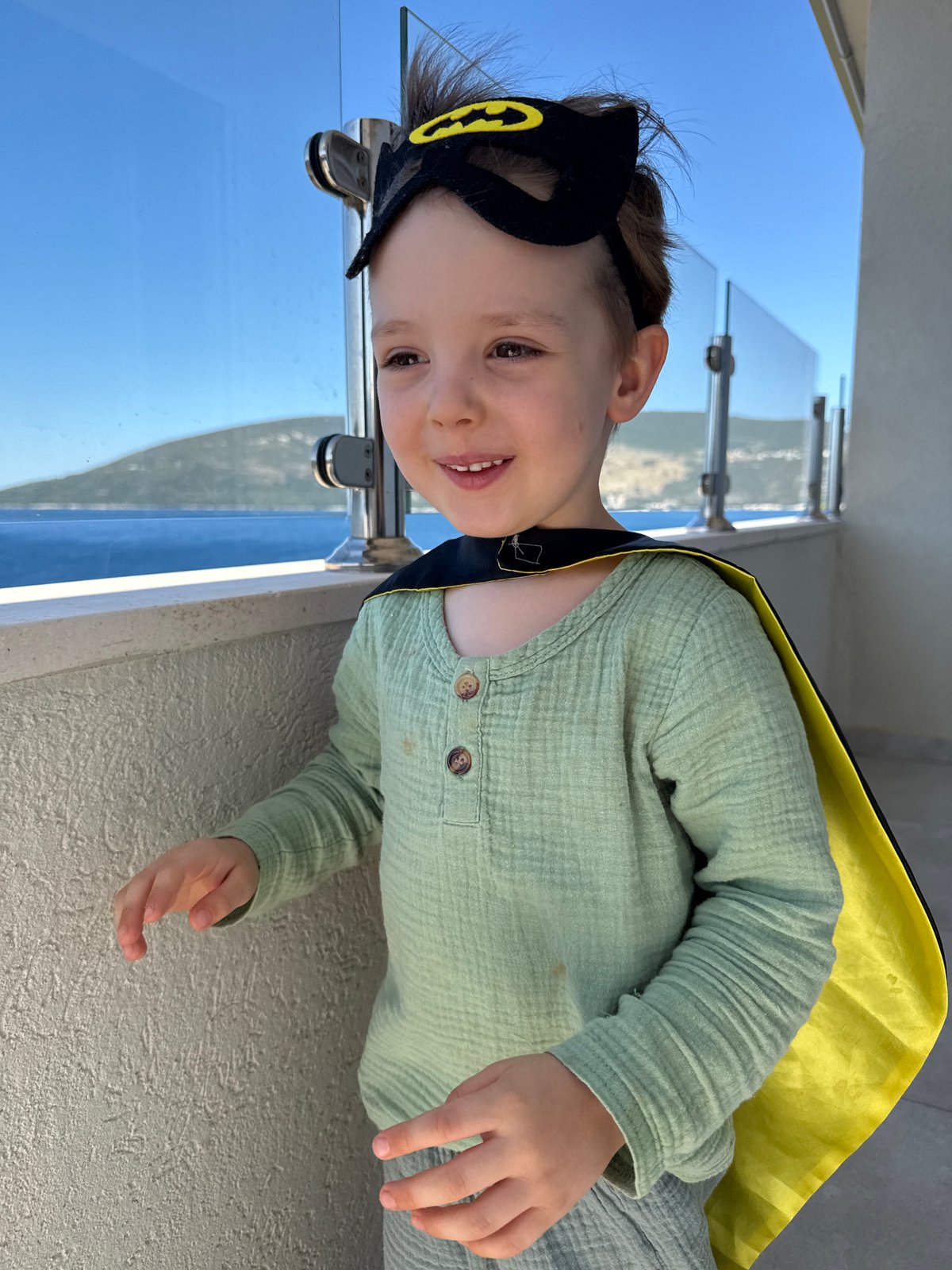 Batman costume on a Herceg Novi balcony above the Bay of Kotor