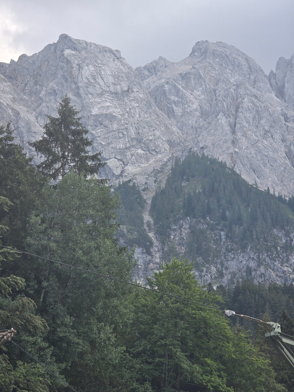 Zugspitze cable car and railway under heavy Alpine cloud cover