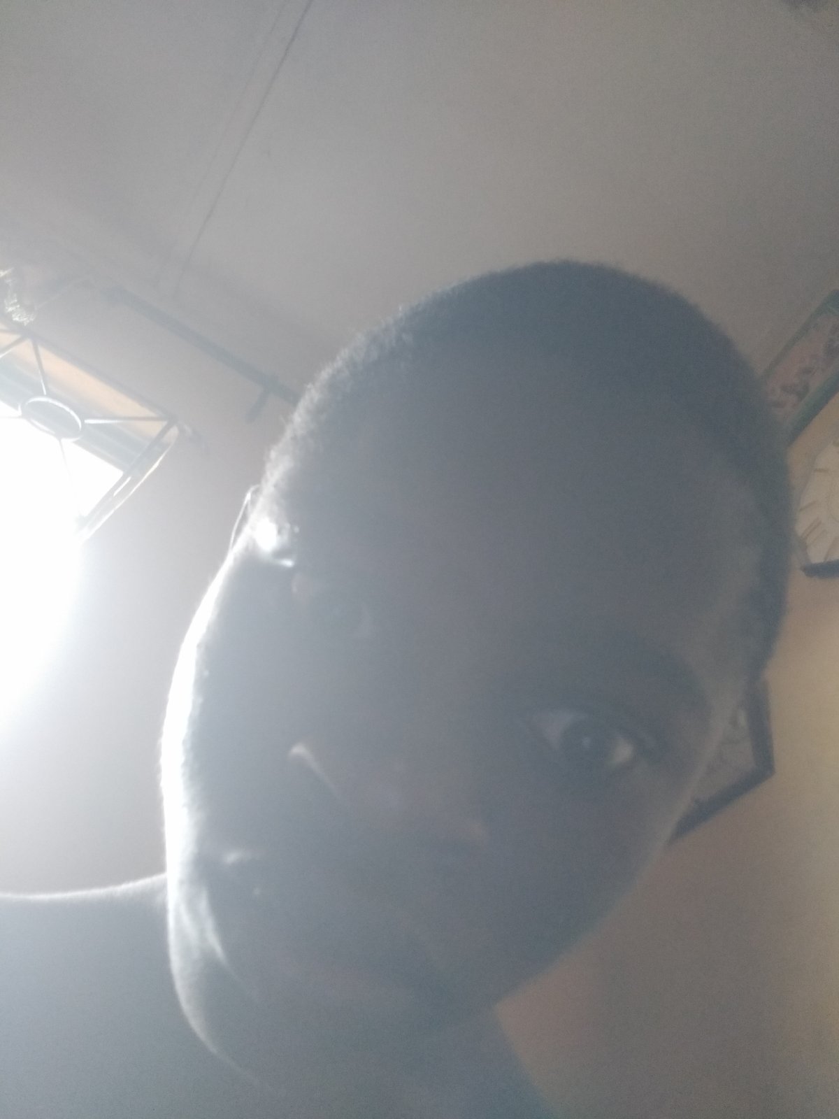 Young person takes playful selfie series in Shangisha, Nigeria
