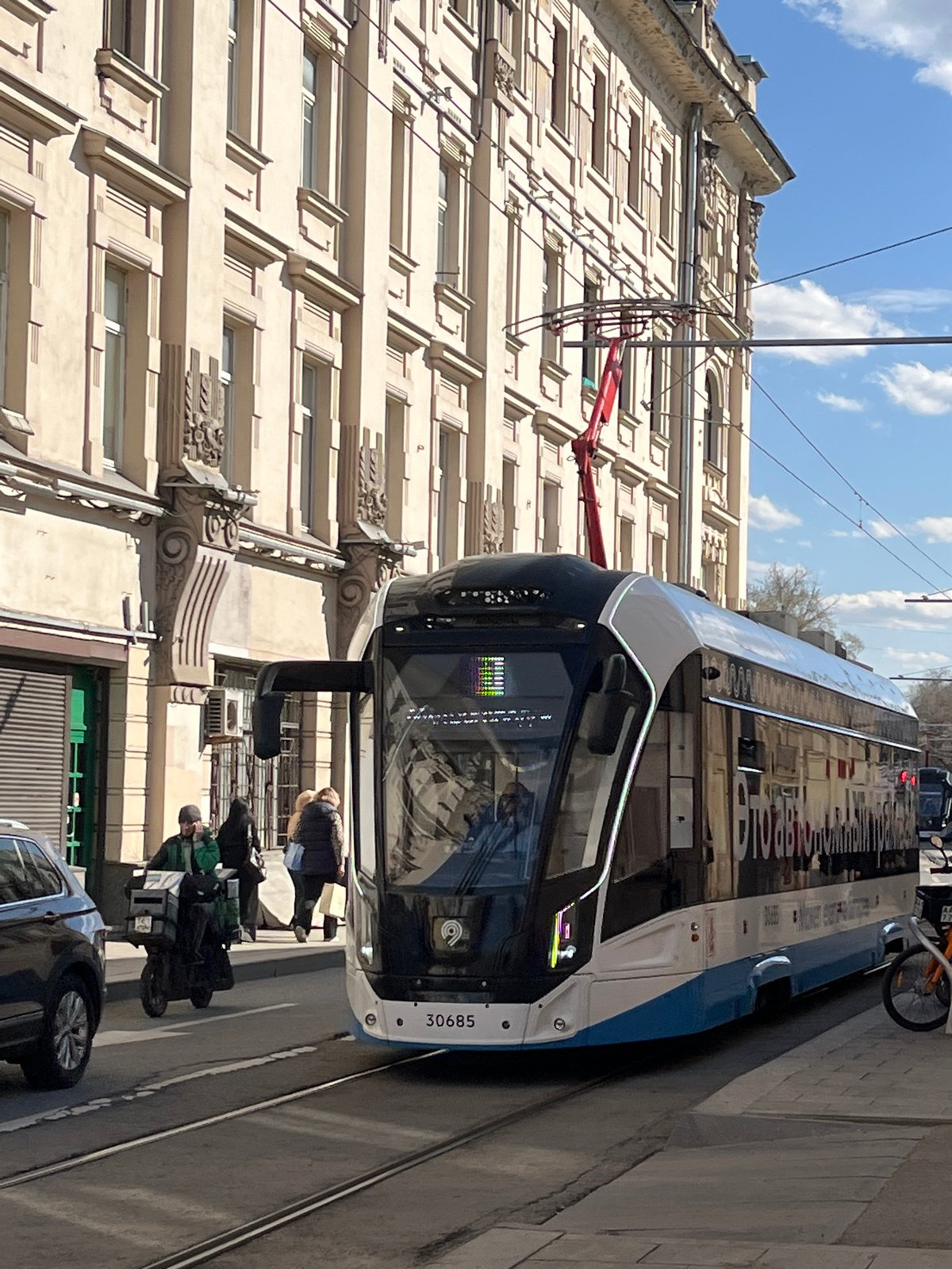 Moscow street scenes: tram, pigeons, pond reflections captured
