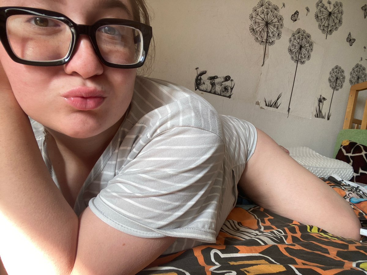 Woman photographed in bedroom poses during early morning in Chaikovsky