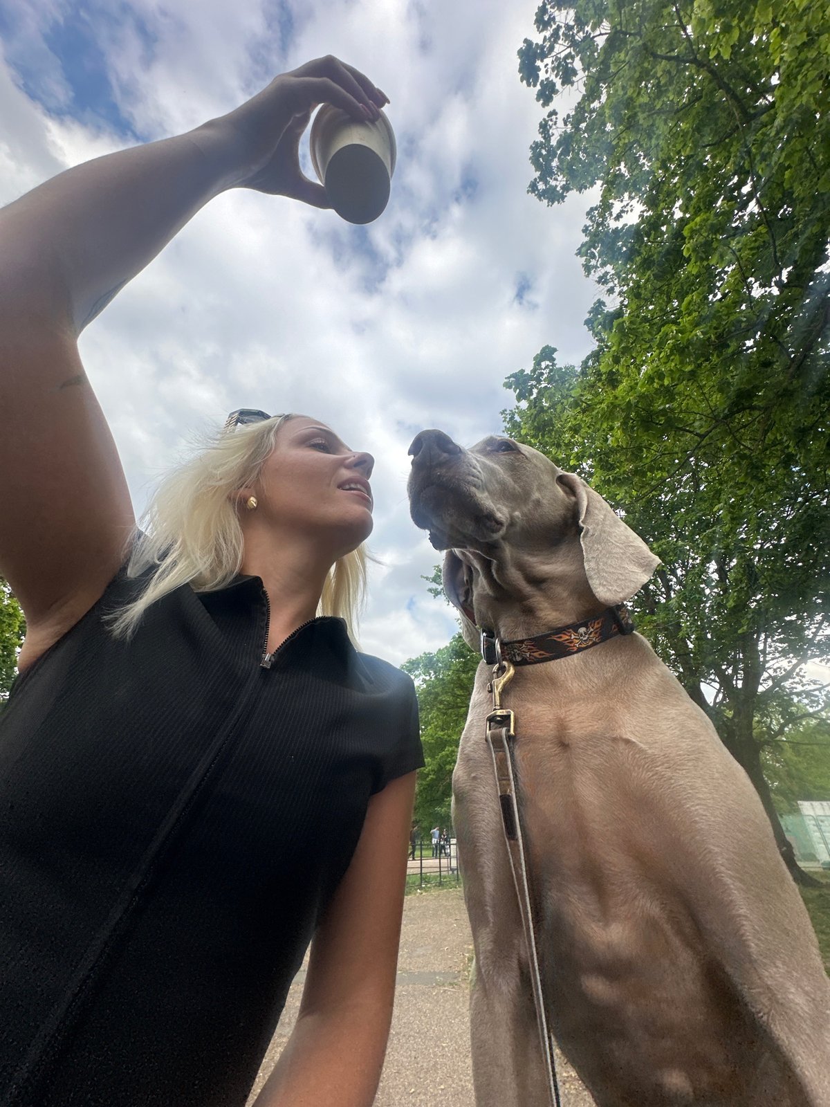 Woman with dog spotted in London park afternoon
