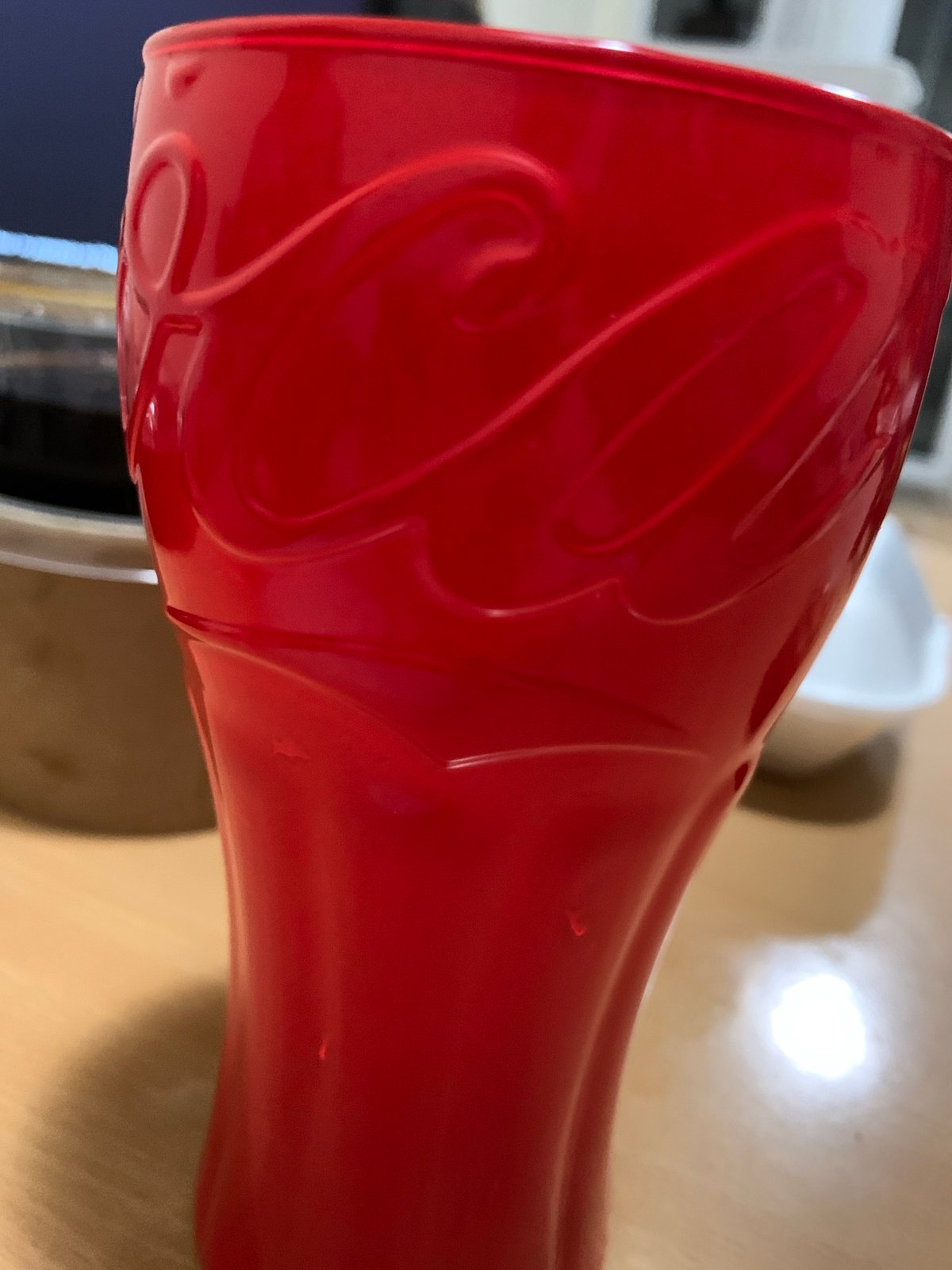 Red Coca-Cola cup photographed indoors in Sofia