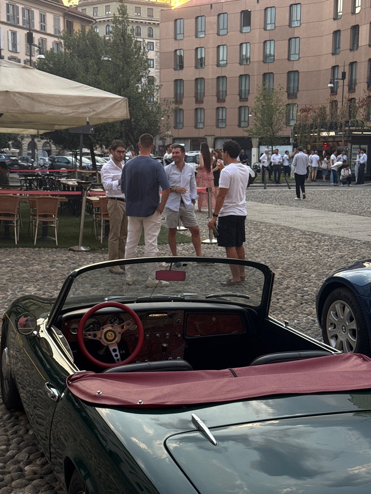 Vintage and classic car meetup on Milan's cobblestone streets