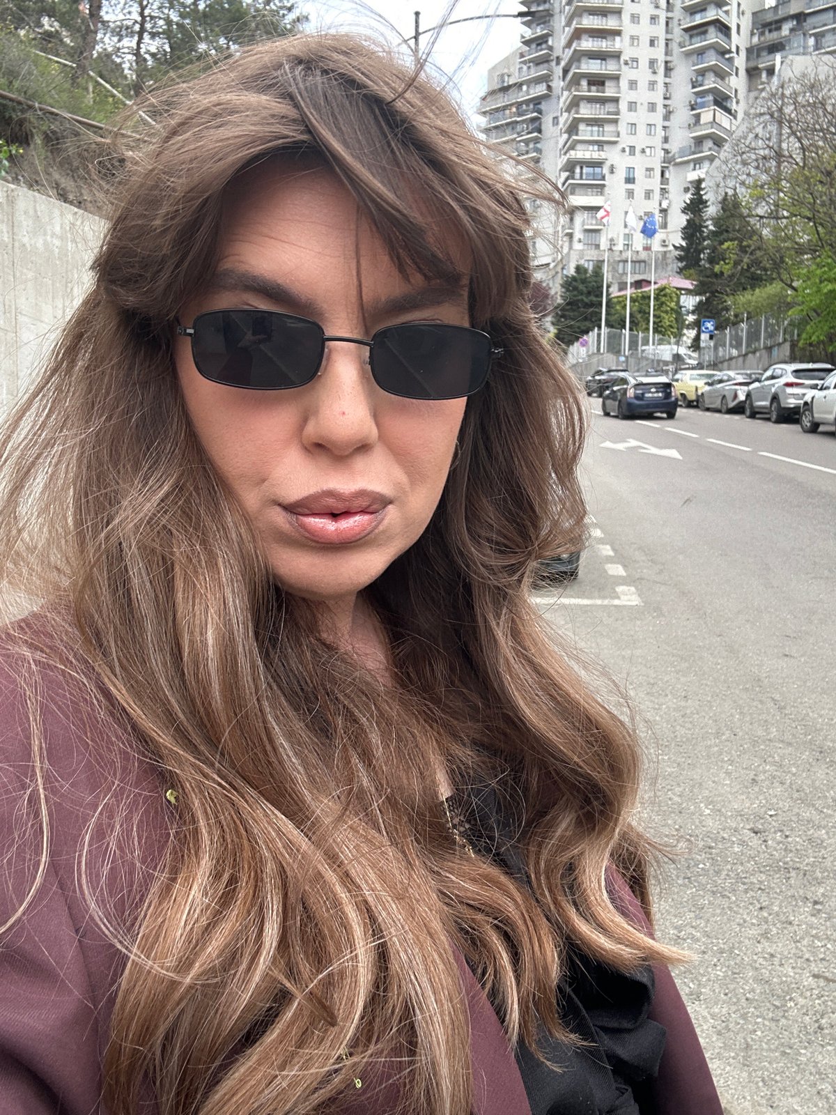 Woman poses for street photoshoot in downtown Tbilisi
