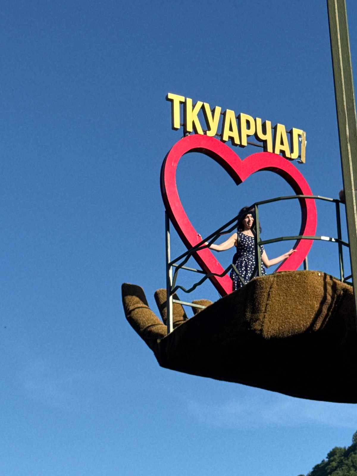 Tourists visit hand-shaped viewing platform monument in Tqwarchal, Abkhazia