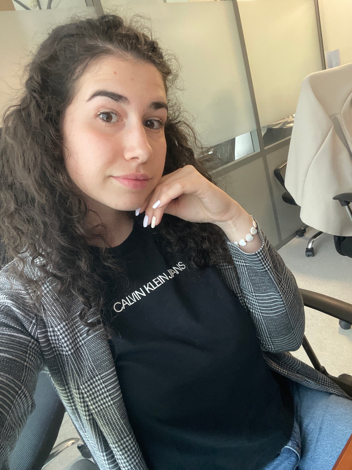Woman works at Sofia office with broken keyboard