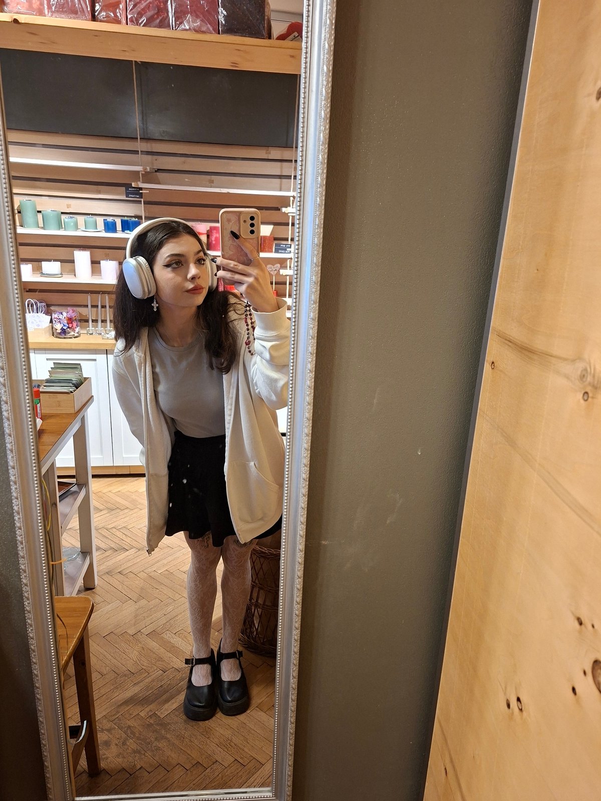 Woman photographed in mirror reflection, Sofia interior space