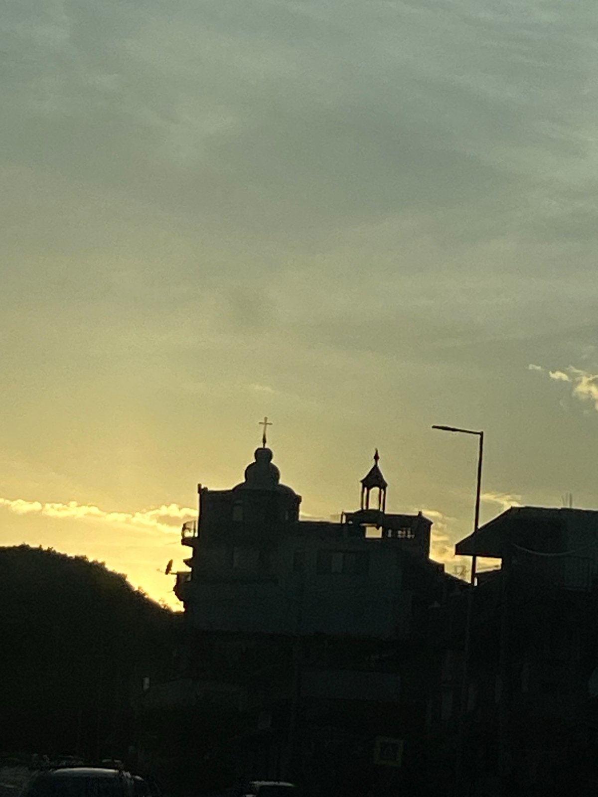 Evening silhouette of church dome captured in Sutomore, Montenegro