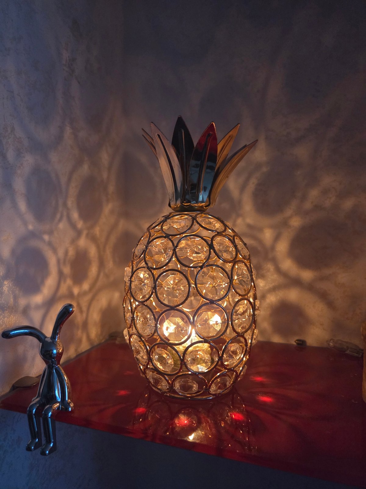 Decorative lamp and colorful figures observed in indoor setting